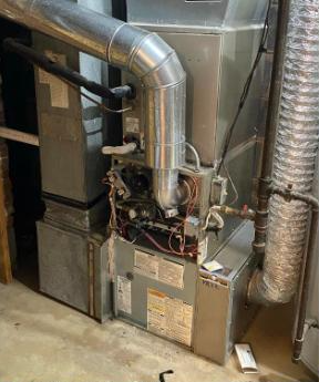 Furnace and flue pipe replacement in a utility room